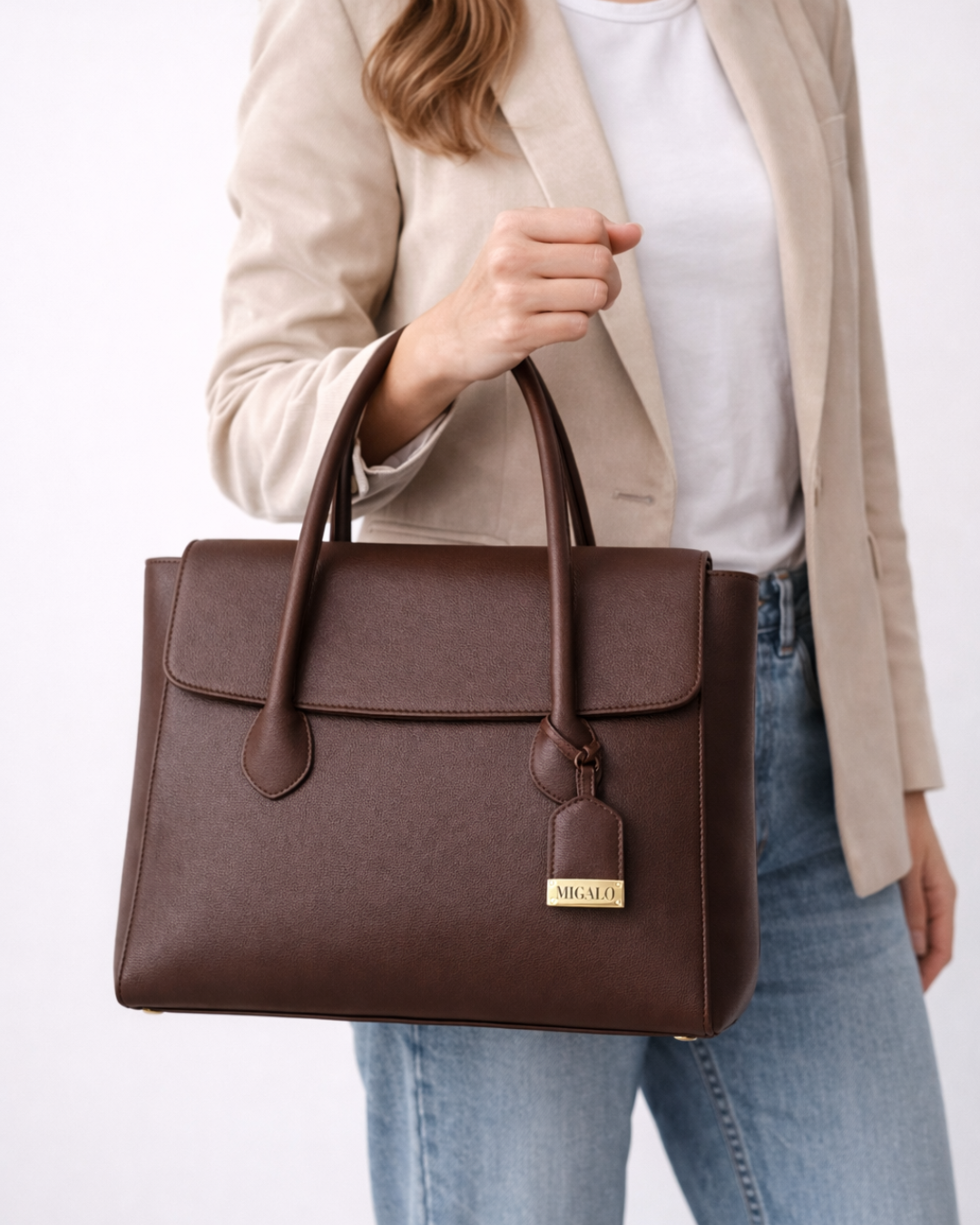 Working women holding brown handbag 